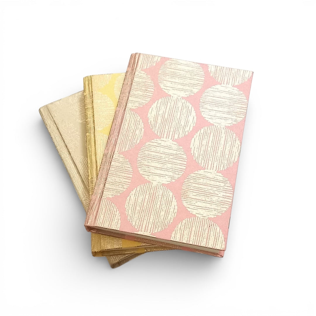 Gifts of Love - Hinode Collection (which means Sunrise in Japanese). Sustainable hardbound journals with Handmade paper, unruled blank pages inside on a white background. 
