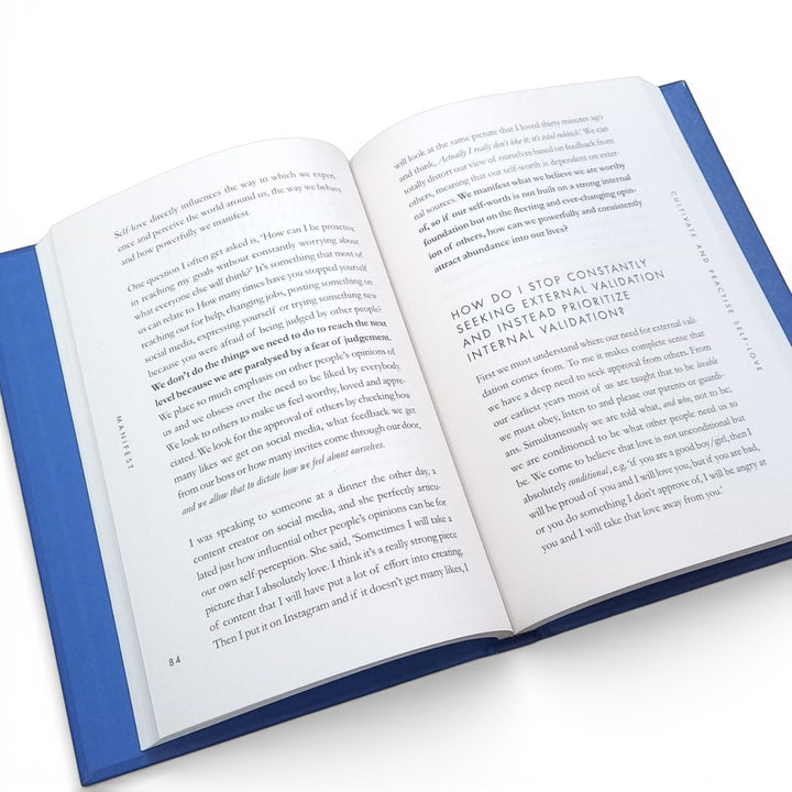 Inside pages of the book titled 'Manifest Dive Deeper' by Roxie Nafousi on a white background at Gifts of Love. 