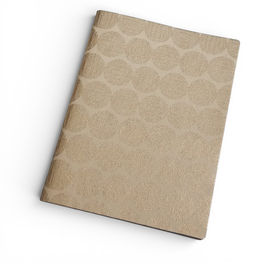 Beige handmade paper notebook with a geometric sunrise pattern on a white background