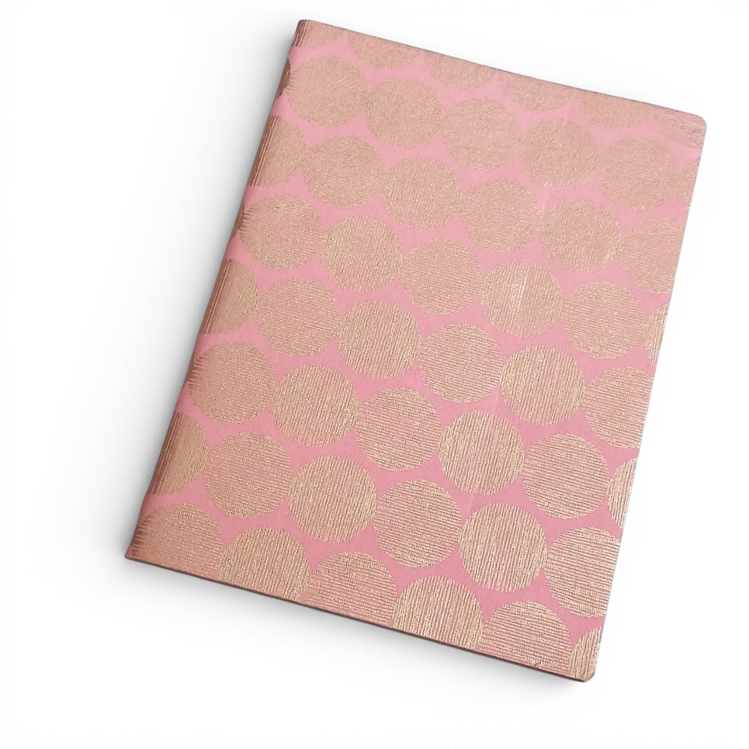 Handmade paper Notebook with pink and gold sunrise pattern on a white background