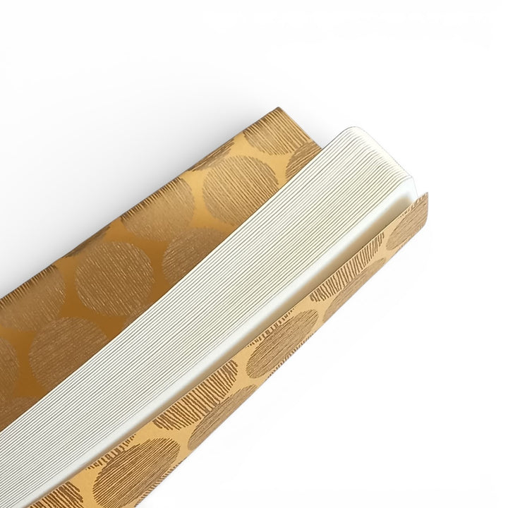 Close-up of the softcover Hinode notebook with blank white pages inside on a white background.