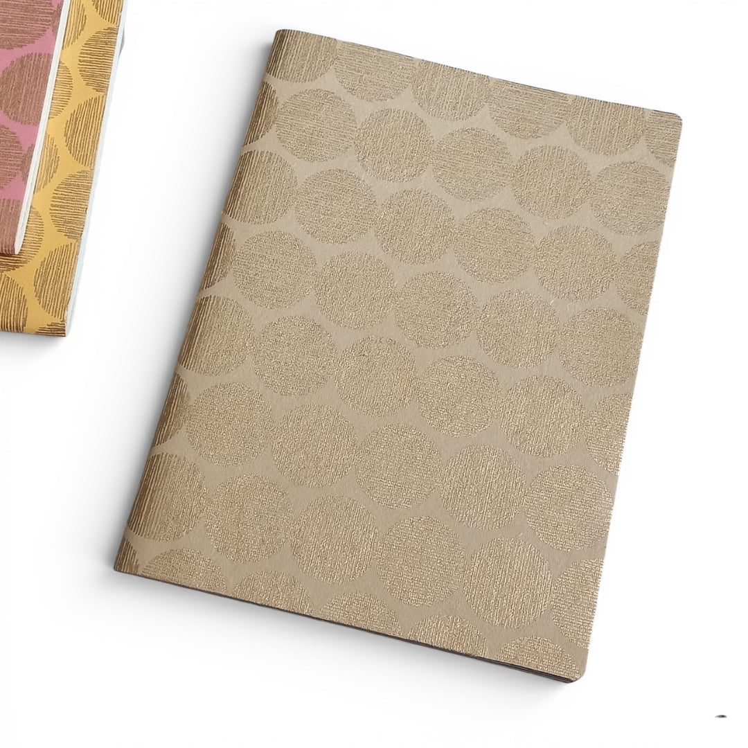 Beige handmade paper notebook with a sunrise geometric pattern on a white background