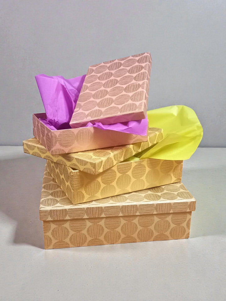 Set of 3 sustainable gift boxes made with handmade paper and board in our Hinode design on a gray background by Gifts of Love. 