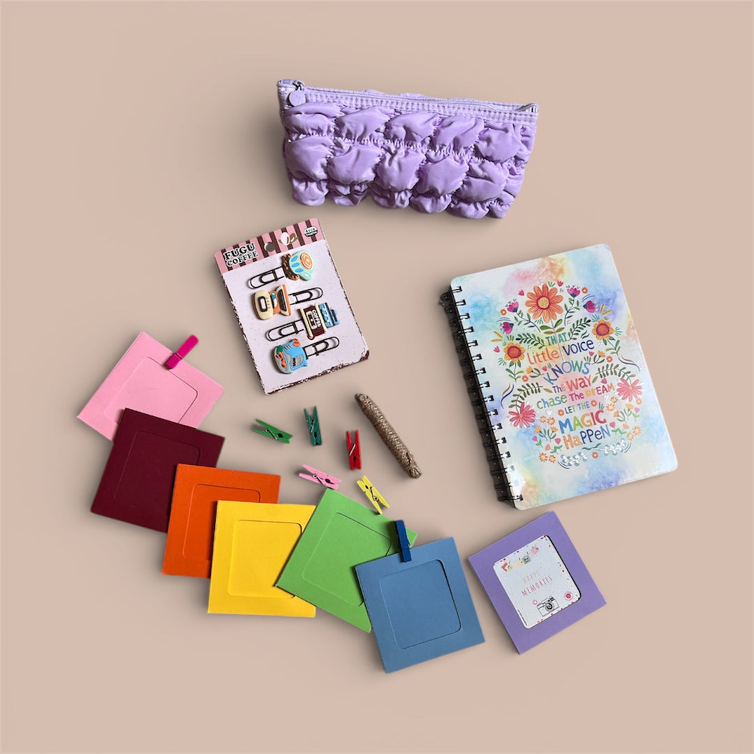 Collection of colorful stationery items including notebooks, clips, photo holder and a pouch on a beige background