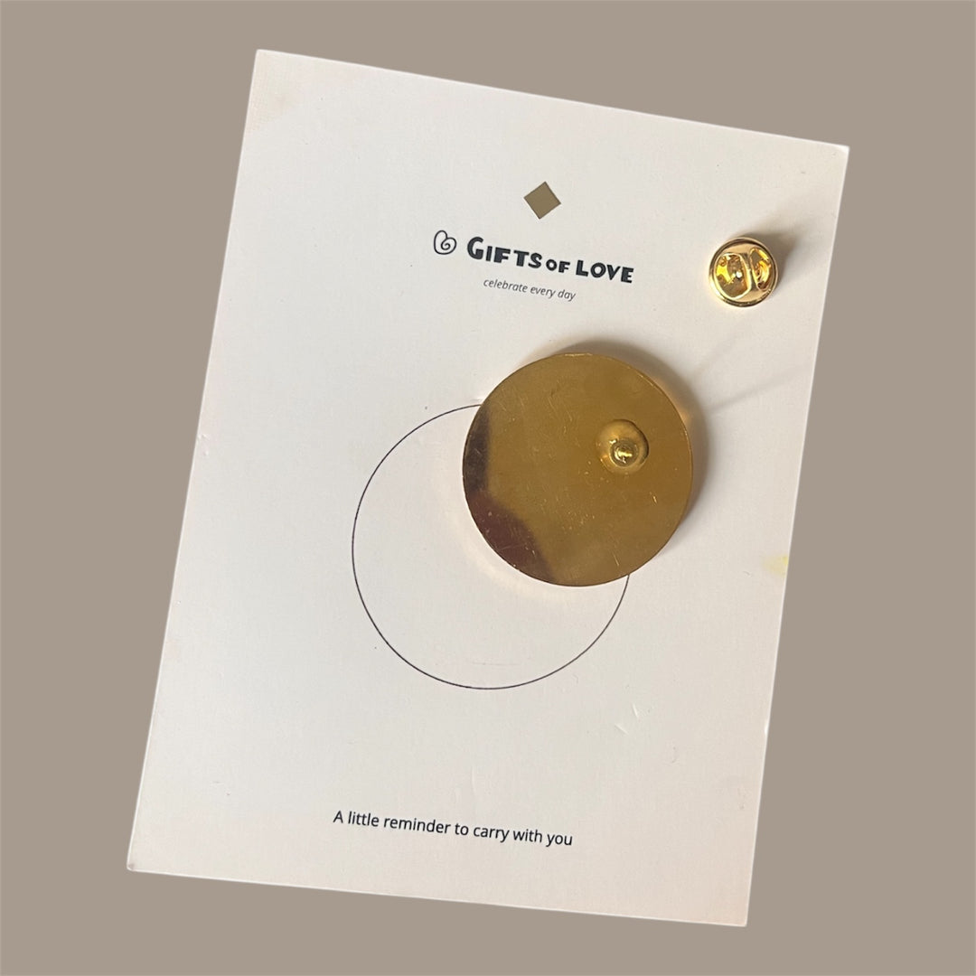 Back image of the circular lapel pin on a &