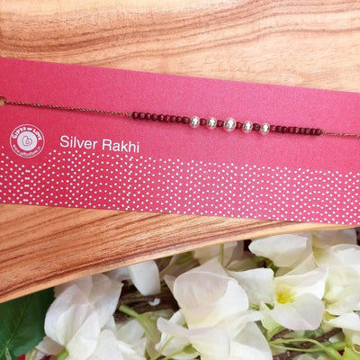 Gifts of Love Anjani Silver Rakhi | Pure 92.5 silver and tulsi beads